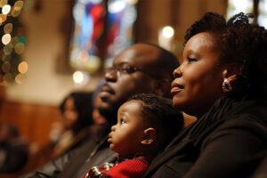 family sitting in church service